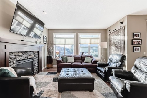 4 Auburn Sound Court Se, Calgary, AB - Indoor Photo Showing Living Room With Fireplace