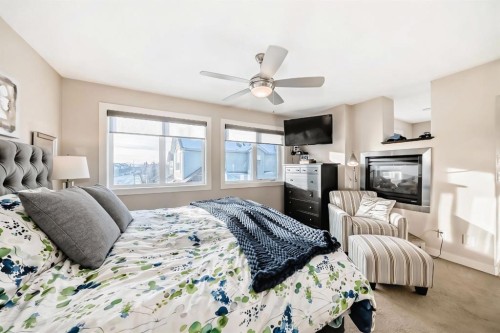 4 Auburn Sound Court Se, Calgary, AB - Indoor Photo Showing Bedroom With Fireplace