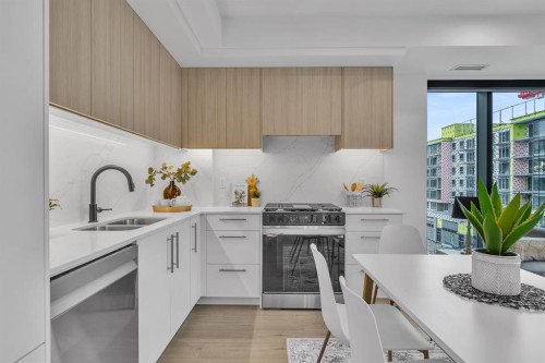 513-8375 Broadcast Avenue Sw, Calgary, AB - Indoor Photo Showing Kitchen With Double Sink With Upgraded Kitchen
