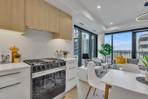 513-8375 Broadcast Avenue Sw, Calgary, AB - Indoor Photo Showing Kitchen With Upgraded Kitchen