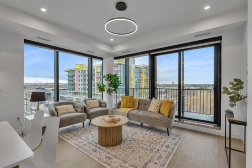 513-8375 Broadcast Avenue Sw, Calgary, AB - Indoor Photo Showing Living Room