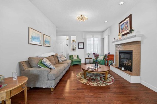 28 Evansview Manor Nw, Calgary, AB - Indoor Photo Showing Living Room With Fireplace
