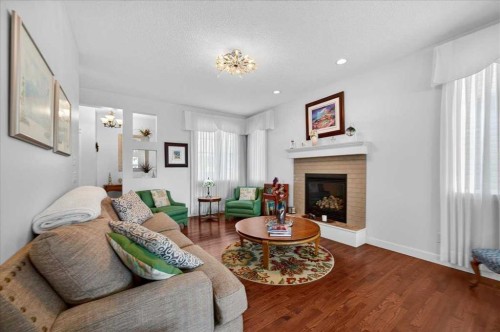 28 Evansview Manor Nw, Calgary, AB - Indoor Photo Showing Living Room With Fireplace