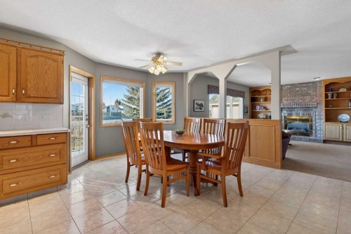 116 Hampshire Grove Nw, Calgary, AB - Indoor Photo Showing Dining Room With Fireplace