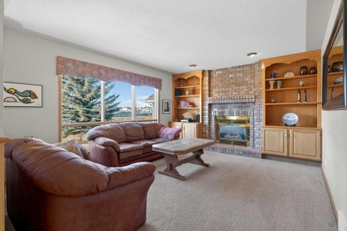 116 Hampshire Grove Nw, Calgary, AB - Indoor Photo Showing Living Room With Fireplace