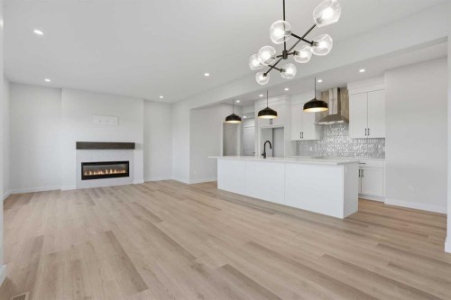 117 Clearwater Terrace, Chestermere, AB - Indoor Photo Showing Other Room With Fireplace