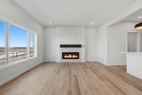 117 Clearwater Terrace, Chestermere, AB - Indoor Photo Showing Living Room With Fireplace