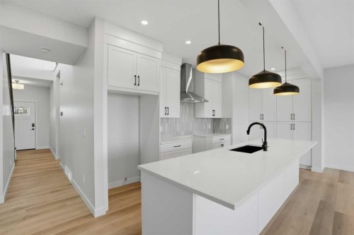 117 Clearwater Terrace, Chestermere, AB - Indoor Photo Showing Kitchen With Upgraded Kitchen