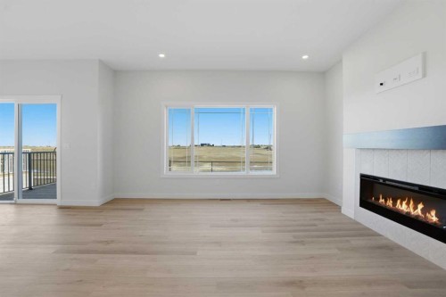 117 Clearwater Terrace, Chestermere, AB - Indoor Photo Showing Living Room With Fireplace