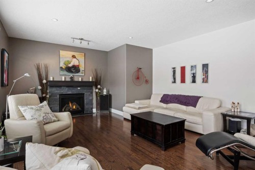 184 Magenta Crescent, Chestermere, AB - Indoor Photo Showing Living Room With Fireplace