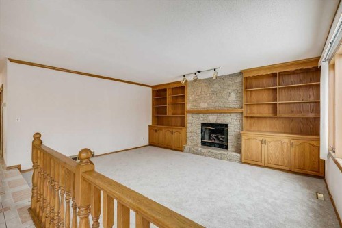 106 Sienna Hills Drive Sw, Calgary, AB - Indoor Photo Showing Other Room With Fireplace
