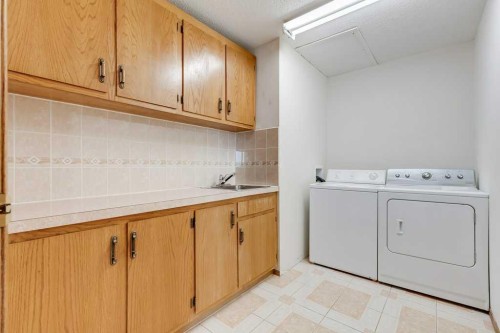 106 Sienna Hills Drive Sw, Calgary, AB - Indoor Photo Showing Laundry Room