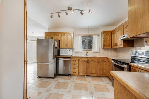 106 Sienna Hills Drive Sw, Calgary, AB - Indoor Photo Showing Kitchen With Stainless Steel Kitchen With Double Sink