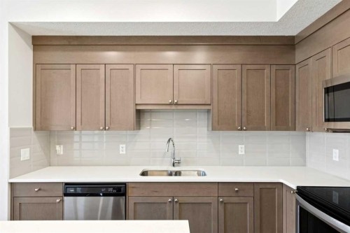 208-30 Shawnee Common Sw, Calgary, AB - Indoor Photo Showing Kitchen With Stainless Steel Kitchen With Double Sink
