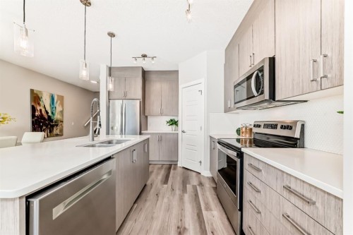 267 Sage Bluff Rise Nw, Calgary, AB - Indoor Photo Showing Kitchen With Double Sink With Upgraded Kitchen