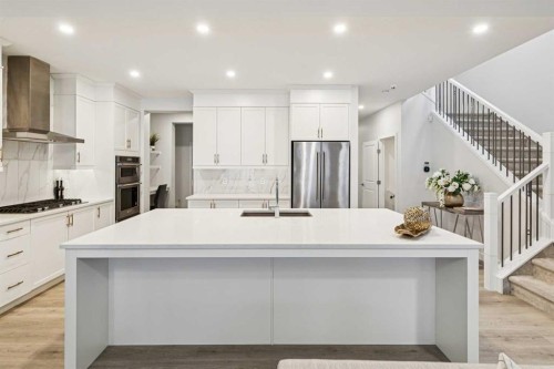 153 Edith Villas Nw, Calgary, AB - Indoor Photo Showing Kitchen With Upgraded Kitchen