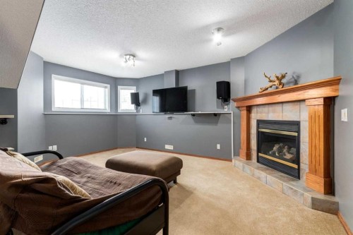 140 Stonegate Close Nw, Airdrie, AB - Indoor With Fireplace