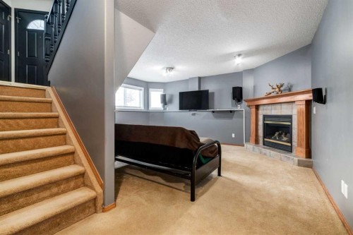 140 Stonegate Close Nw, Airdrie, AB - Indoor With Fireplace