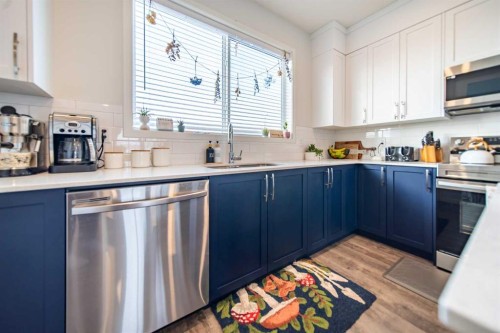 27 Iris Crescent, Okotoks, AB - Indoor Photo Showing Kitchen With Stainless Steel Kitchen With Upgraded Kitchen
