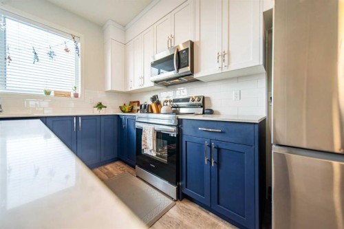 27 Iris Crescent, Okotoks, AB - Indoor Photo Showing Kitchen With Stainless Steel Kitchen With Upgraded Kitchen
