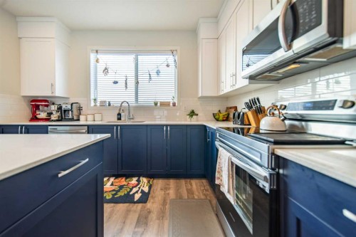 27 Iris Crescent, Okotoks, AB - Indoor Photo Showing Kitchen With Upgraded Kitchen