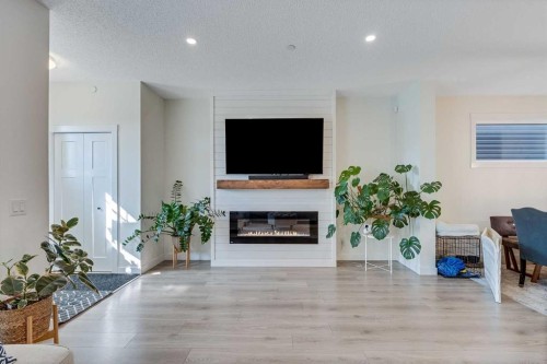 145 Lucas Crescent Nw, Calgary, AB - Indoor Photo Showing Living Room With Fireplace