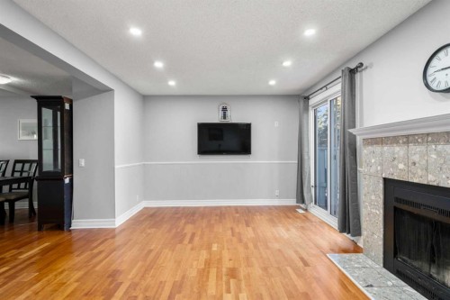 15-200 Shawnessy Drive Sw, Calgary, AB - Indoor With Fireplace