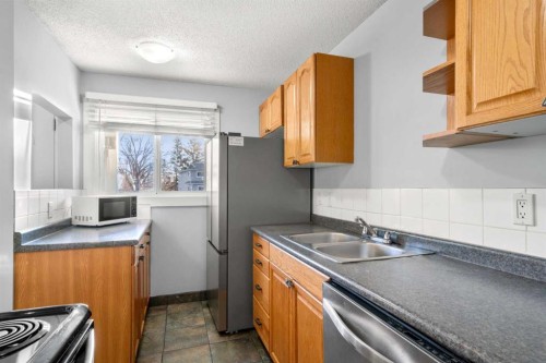 15-200 Shawnessy Drive Sw, Calgary, AB - Indoor Photo Showing Kitchen With Double Sink