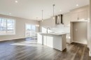 311 Dawson Dock Way, Chestermere, AB  - Indoor Photo Showing Kitchen With Upgraded Kitchen 
