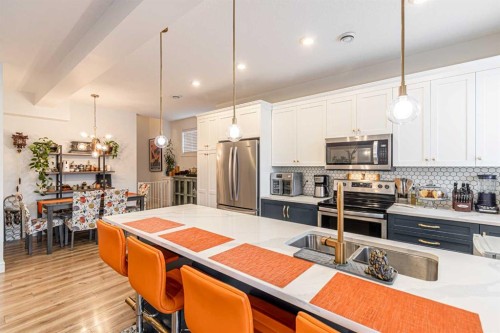 4307 Seton Drive Se, Calgary, AB - Indoor Photo Showing Kitchen With Stainless Steel Kitchen With Double Sink With Upgraded Kitchen