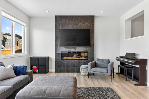 57 Legacy Reach View Se, Calgary, AB - Indoor Photo Showing Living Room With Fireplace