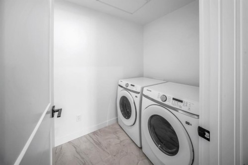 205-10 Cascade Ridge, Canmore, AB - Indoor Photo Showing Laundry Room