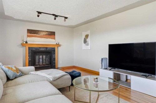 3003 25 Street Sw, Calgary, AB - Indoor Photo Showing Living Room With Fireplace