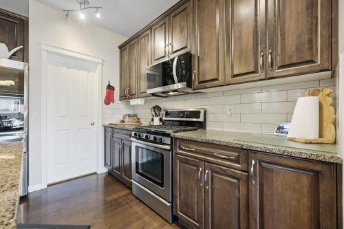 56 Jumping Pound Rise, Cochrane, AB - Indoor Photo Showing Kitchen