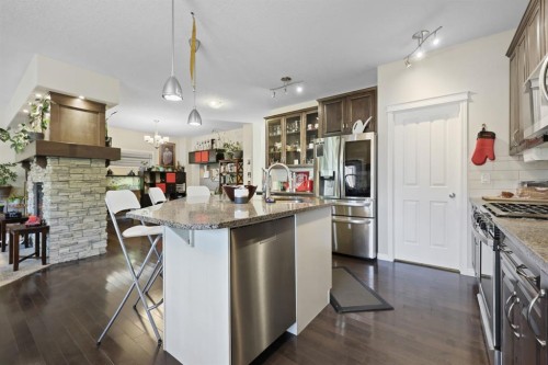 56 Jumping Pound Rise, Cochrane, AB - Indoor Photo Showing Kitchen With Upgraded Kitchen
