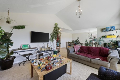 56 Jumping Pound Rise, Cochrane, AB - Indoor Photo Showing Living Room