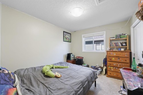 56 Jumping Pound Rise, Cochrane, AB - Indoor Photo Showing Bedroom