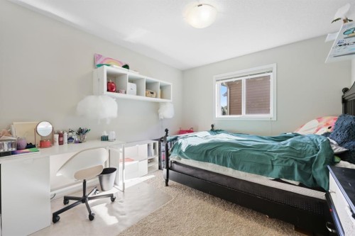 56 Jumping Pound Rise, Cochrane, AB - Indoor Photo Showing Bedroom