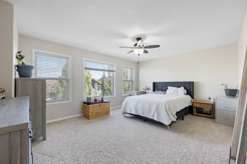 56 Jumping Pound Rise, Cochrane, AB - Indoor Photo Showing Bedroom