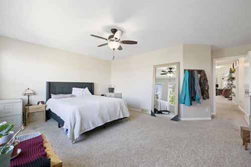 56 Jumping Pound Rise, Cochrane, AB - Indoor Photo Showing Bedroom