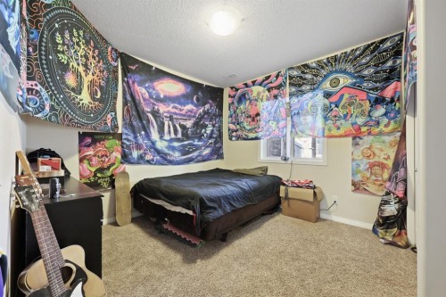 56 Jumping Pound Rise, Cochrane, AB - Indoor Photo Showing Bedroom