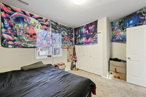 56 Jumping Pound Rise, Cochrane, AB - Indoor Photo Showing Bedroom