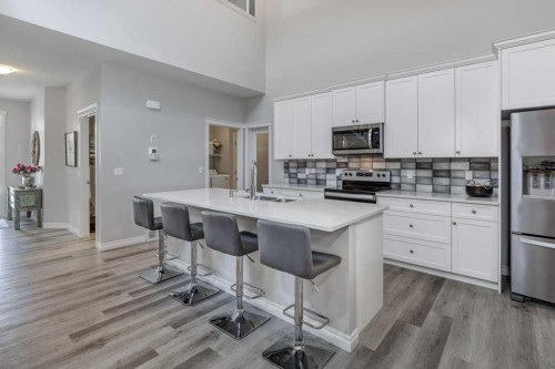 380 Rivercrest View, Cochrane, AB - Indoor Photo Showing Kitchen With Stainless Steel Kitchen
