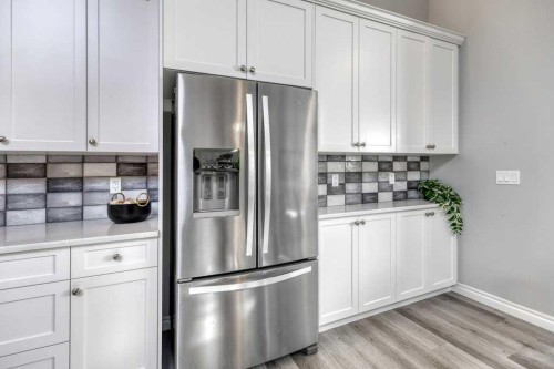 380 Rivercrest View, Cochrane, AB - Indoor Photo Showing Kitchen With Stainless Steel Kitchen