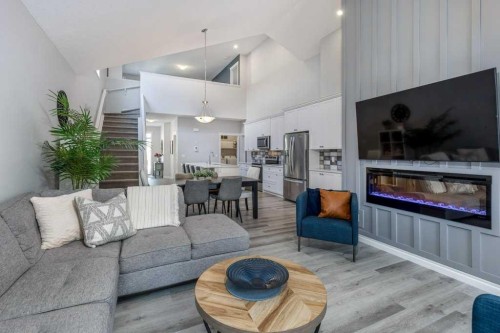 380 Rivercrest View, Cochrane, AB - Indoor Photo Showing Living Room With Fireplace