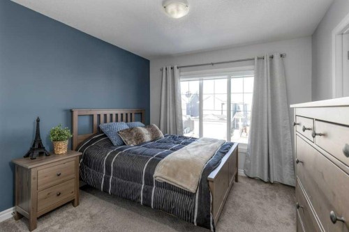 380 Rivercrest View, Cochrane, AB - Indoor Photo Showing Bedroom