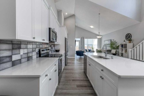 380 Rivercrest View, Cochrane, AB - Indoor Photo Showing Kitchen With Double Sink
