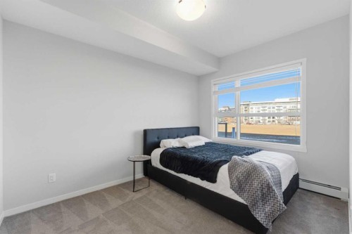211-4150 Seton Drive Se, Calgary, AB - Indoor Photo Showing Bedroom