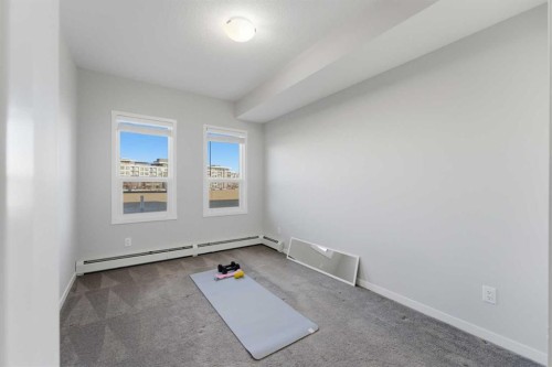 211-4150 Seton Drive Se, Calgary, AB - Indoor Photo Showing Other Room