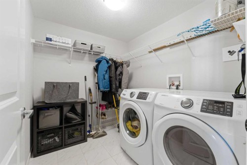 211-4150 Seton Drive Se, Calgary, AB - Indoor Photo Showing Laundry Room